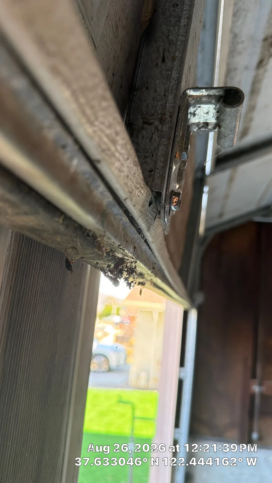 Detached center stile on the bottom section of a San Bruno garage door.